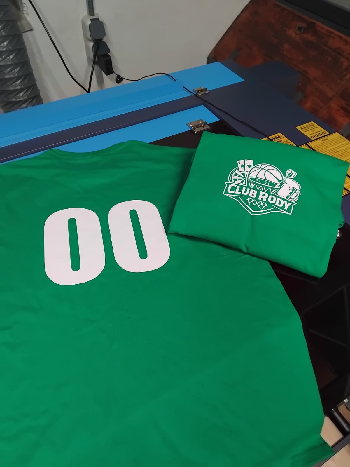Branded textile pieces with custom heat-applied graphics