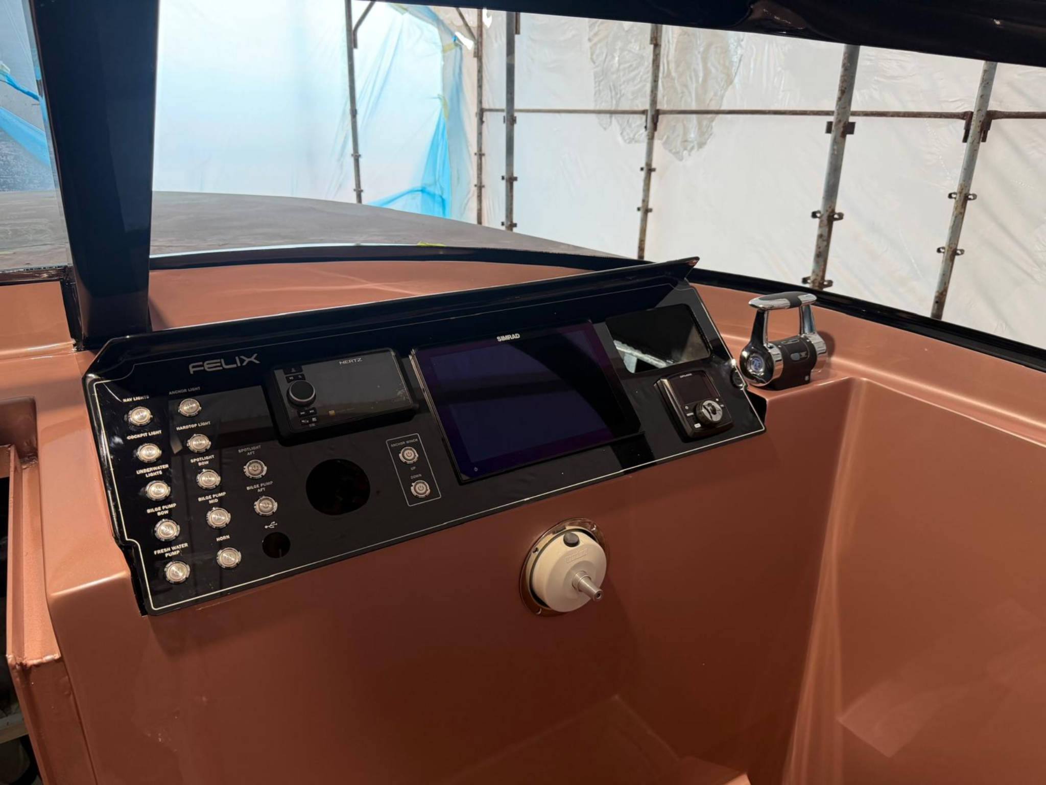 Finished marine control panel installed at the helm